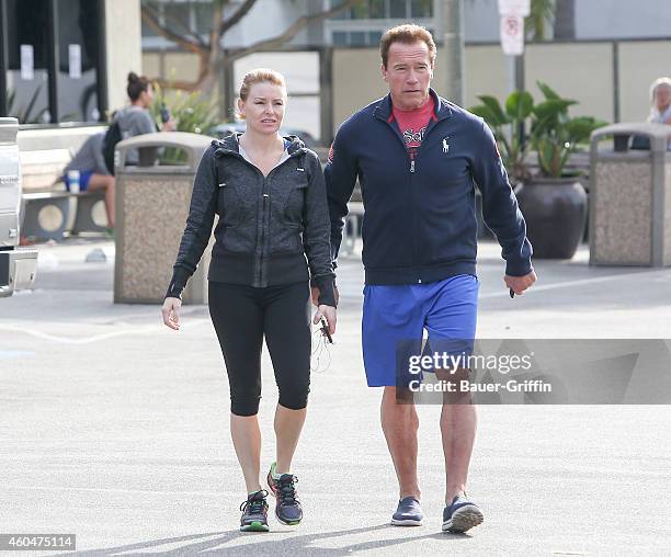 Arnold Schwarzenegger and Heather Milligan are seen on December 14, 2014 in Los Angeles, California.