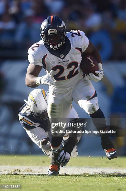 Denver Broncos running back C.J. Anderson rumbles for yardage past San Diego Chargers defensive tackle Cory Liuget during the first quarter on...