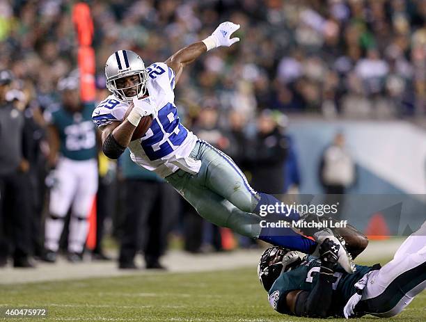 DeMarco Murray of the Dallas Cowboys is tackled during the game against the Philadelphia Eagles at Lincoln Financial Field on December 14, 2014 in...