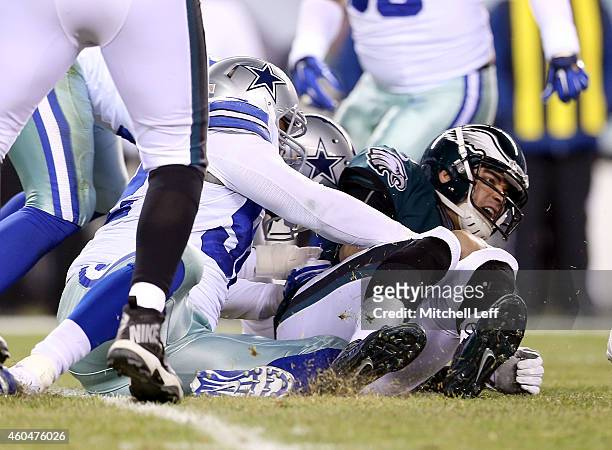 Mark Sanchez of the Philadelphia Eagles is sacked by Jeremy Mincey of the Dallas Cowboys at Lincoln Financial Field on December 14, 2014 in...