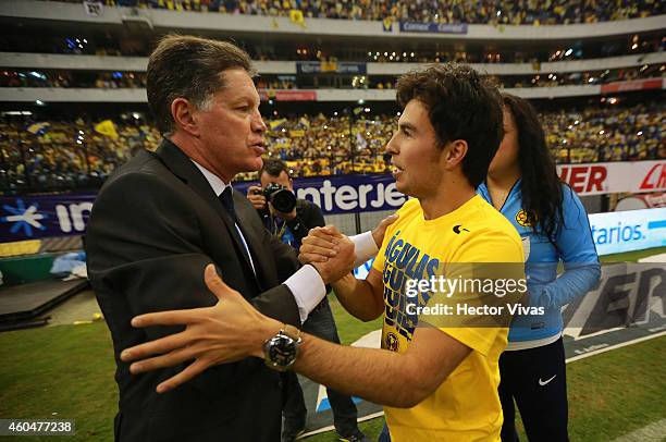 Ricardo Pelaez Sports Director of America celebrates with Formula One driver Sergio Perez after a Final second leg match between America and Tigres...