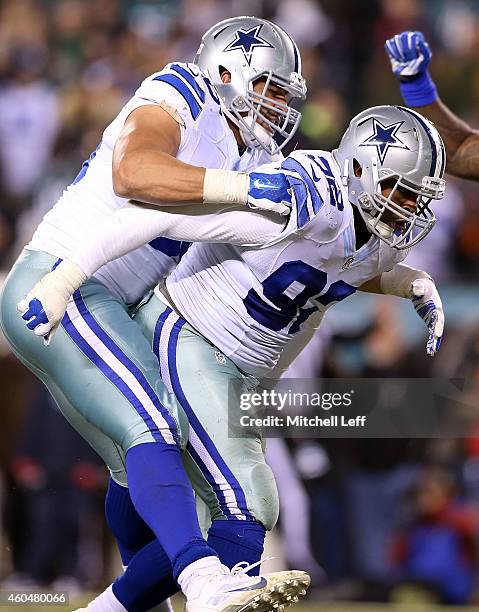 Jeremy Mincey of the Dallas Cowboys is congratulated by Tyrone Crawford during the game against the Philadelphia Eagles at Lincoln Financial Field on...