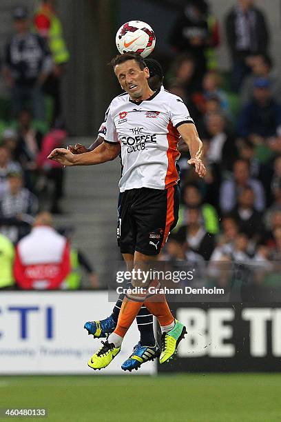 Liam Miller of the Roar heads the ball during the round 13 A-League match between the Melbourne Victory and Brisbane Roar at AAMI Park on January 4,...