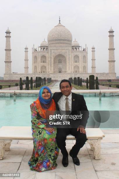 Maldives President Abdullah Yamin Abdul Gyyum and his wife pose in front of the Taj Mahal in Agra on January 4, 2014. Gayoom is in India for a...