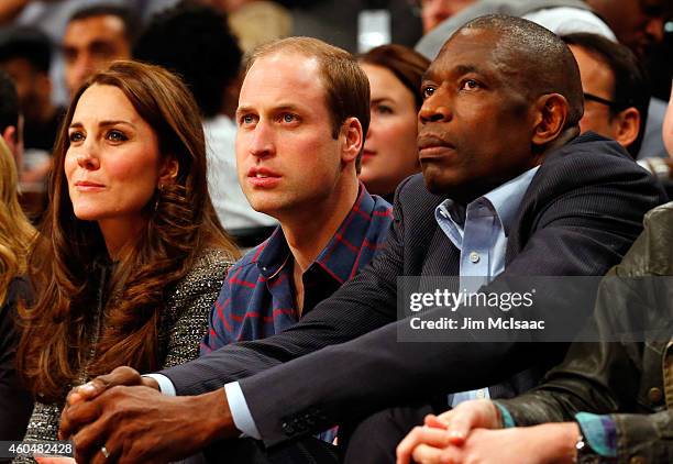 Prince William, Duke of Cambridge , Catherine, Duchess of Cambridge and former NBA player Dikembe Mutombo attend a game between the Brooklyn Nets and...