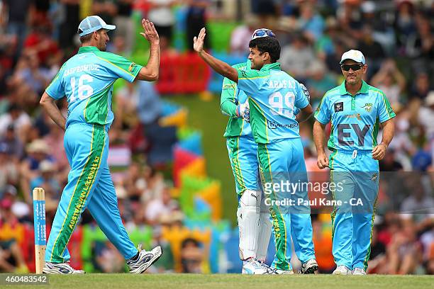 Yasir Arafat of the Legends XI celebrates with Michael Kasprowicz of the Legends XI after dismissing Michael Carberry of the Scorchers during the...