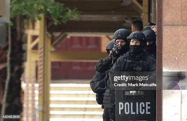 Armed police are seen outside the Lindt Cafe, Martin Place on December 15, 2014 in Sydney, Australia. Police attend a hostage situation at Lindt Cafe...