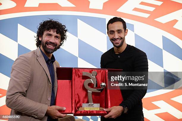 Damiano Tommasi, president of the Italian Footballers' Association honours Mehdi Benatia of Bayern Muenchen as member of Serie A-team of the year...
