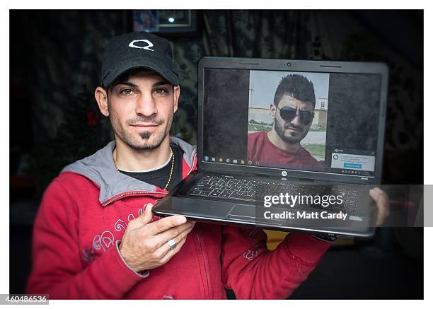 Iraqi Christian, Nawar Jarjees, poses for a photograph in his tented home erected in the grounds of Mazar Mar Eillia Catholic Church, that has now...