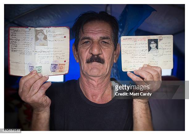 Iraqi Christian Kamil Abdulahad poses for a photograph in his tented home erected in the grounds of Mazar Mar Eillia Catholic Church, that has now...