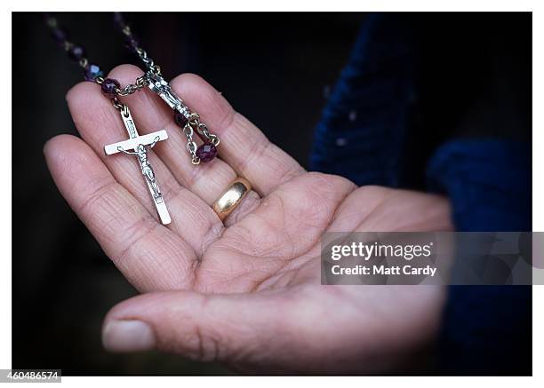 Iraqi Christian, Raneen Nisan, who asked not to have her face shown, poses for a photograph in her tented home erected in the grounds of Mazar Mar...