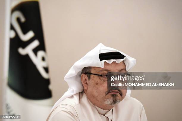 General manager of Alarab TV, Jamal Khashoggi, looks on during a press conference in the Bahraini capital Manama, on December 15, 2014. The pan-Arab...