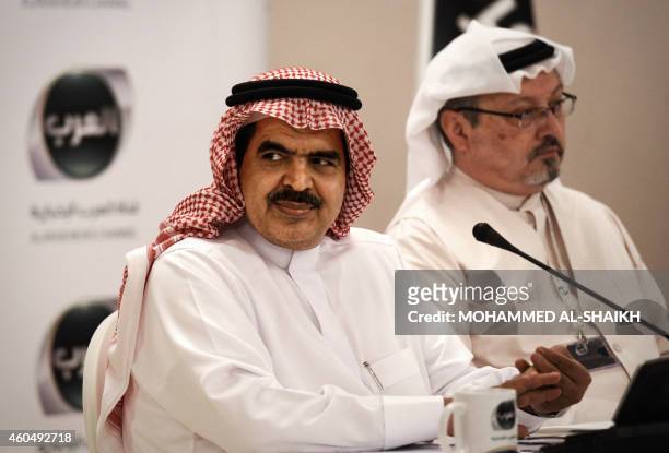 The chairman of the board and chief executive officer of Alarab TV, Fahad al-Sukait , and the general manager of Alarab TV, Jamal Khashoggi, look on...