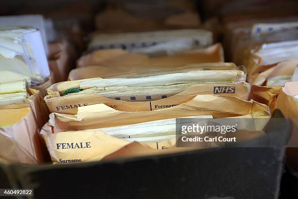 Folders containing patient records are pictured in a General Practitioners surgery on December 4, 2014 in London, England. Ahead of next years...