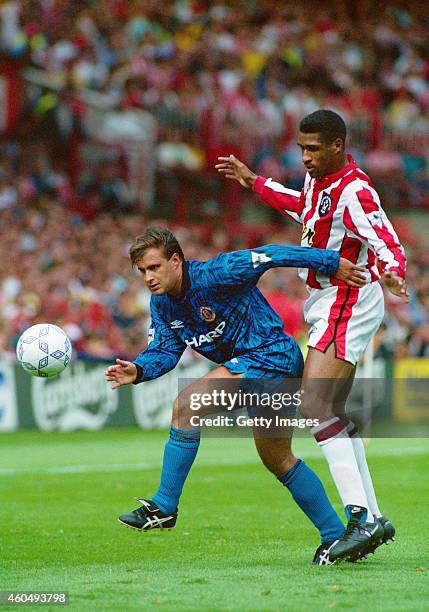 Manchester United player Clayton Blackmore holds off Sheffield United striker Brian Deane during the first round of FA Premier League games at...