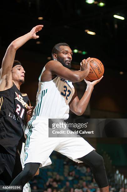 Jordan Hamilton of the Reno Bighorns passes to a teammate guarded by John Bohannon of the Erie BayHawks during an NBA D-League game on December 14,...