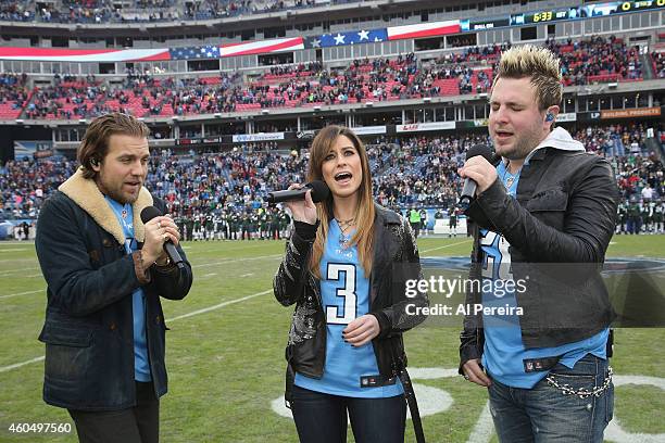 Tom Gossin, Rachel Reinert and Mike Gossin of Gloriana perform the National Anthem before the New York Jets Vs Tennessee Titans game at LP Field on...