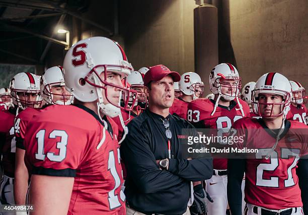 Jim Harbaugh, head coach of the Stanford Cardinal, waits with his team to enter the field prior to an NCAA football game against the San Jose State...