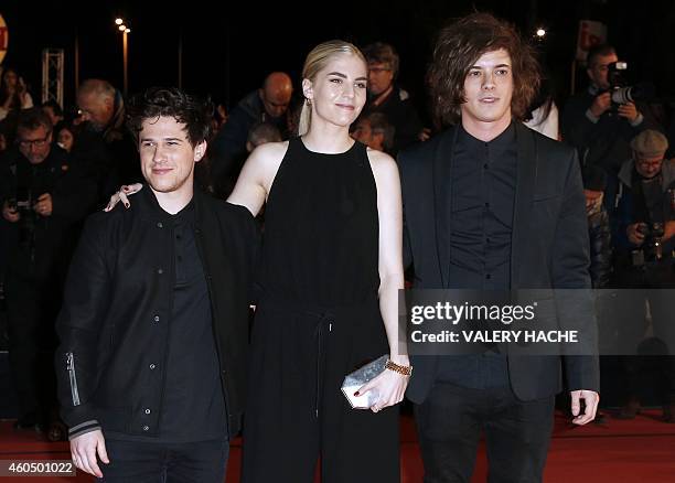 ) Members of the band London Grammar Dan Rothman, Hannah Reid and Dominic "Dot" Major pose upon their arrival at the Palais des Festivals to attend...
