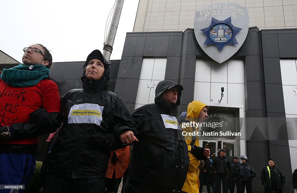 Protestors Chain Themselves To Oakland PD Headquarters