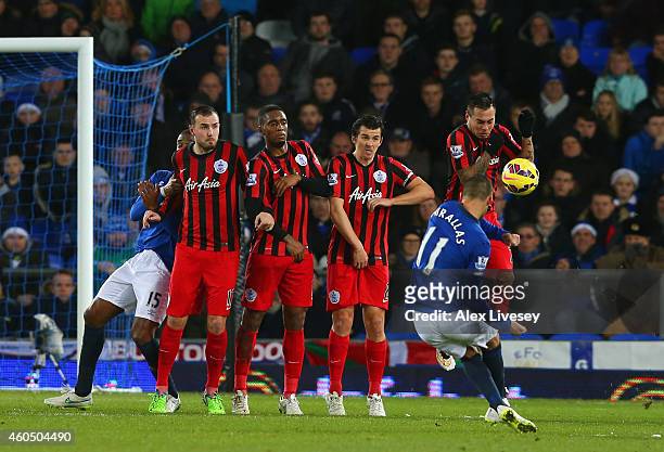 Kevin Mirallas of Everton scores their second goal from a free kick during the Barclays Premier League match between Everton and Queens Park Rangers...