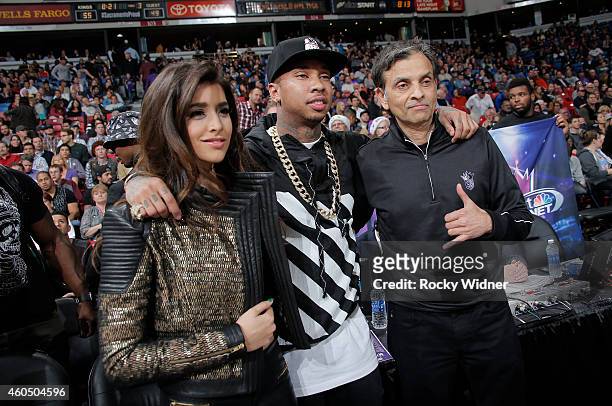 Anjali Ranadivé, American Rapper Tyga and Sacramento Kings owner Vivek Ranadivé pose for a photo during the game between the Utah Jazz and Sacramento...