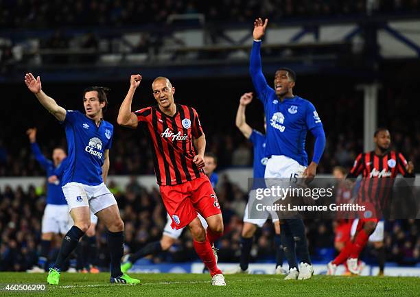 Bobby Zamora of QPR celebrates scoring their first goal as Leighton Baines and Sylvain Distin of Everton appeal during the Barclays Premier League...