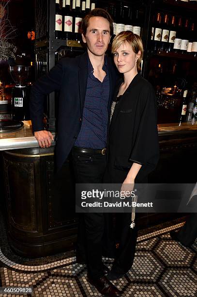 Model Edie Campbell and Otis Ferry attend the LOVE x Balmain Xmas Party at The Ivy Market Grill on December 15, 2014 in London, England.