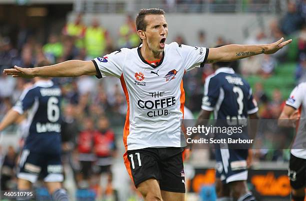 Liam Miller of the Roar celebrates after scoring the first goal of the game during the round 13 A-League match between the Melbourne Victory and...