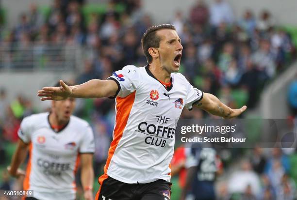 Liam Miller of the Roar celebrates after scoring the first goal of the game during the round 13 A-League match between the Melbourne Victory and...