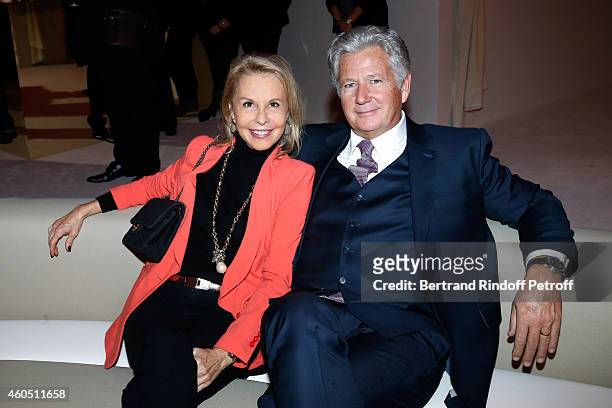 Host Pierre Dhostel and wife Carole Bellemarre attend the Louis Vuitton Montaigne Store Re-Opening party at Louis Vuitton Avenue Montaigne Store on...