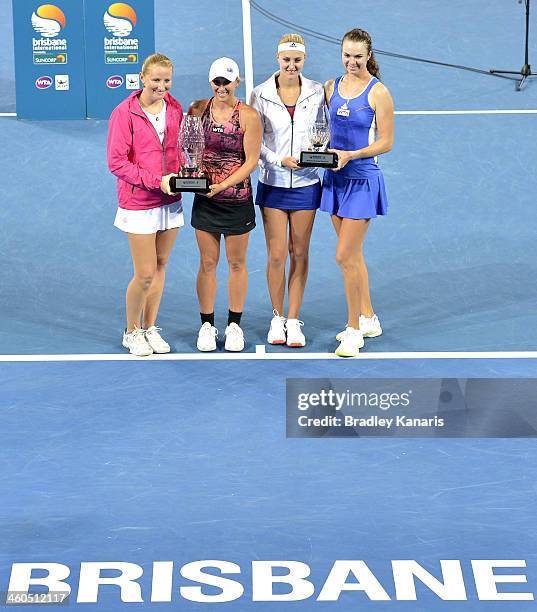 Alla Kudryavtseva of Russia and Anastasia Rodionova of Australia hold up the winners trophy after winning the Womens doubles final against Kristina...