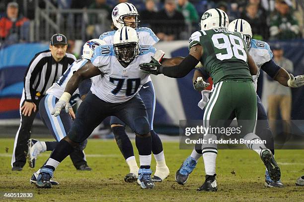 Chance Warmack of the Tennessee Titans blocks Quinton Coples of the New York Jets at LP Field on December 14, 2014 in Nashville, Tennessee.