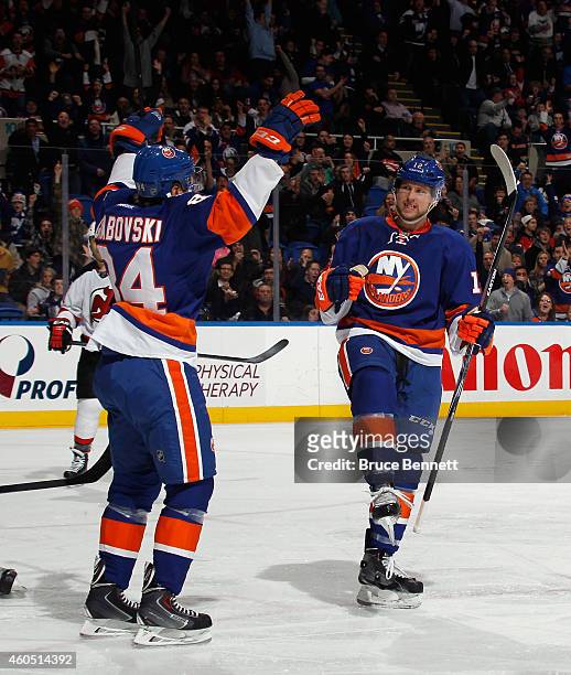 Josh Bailey celebrates his goal at 1:51 of the second period against the New Jersey Devils and is joined by Mikhail Grabovski at the Nassau Veterans...