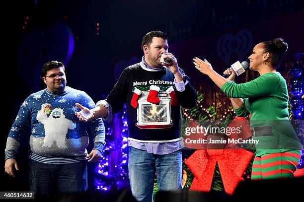 Radio personalities Erick, Kane, and Danni of "The Kane Show" speak onstage during HOT 99.5s Jingle Ball 2014, Presented by Mattress Warehouse at...