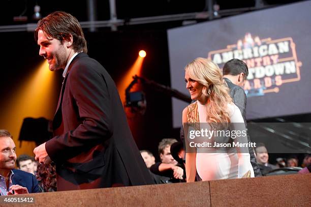 The Nashville Predators' Mike Fisher and recording artist Carrie Underwood attend the 2014 American Country Countdown Awards at Music City Center on...