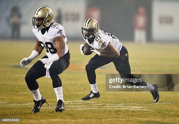 Jamarca Sanford of the New Orleans Saints blocks for Patrick Robinson after he intercepted a pass during the first quarter of their game against the...