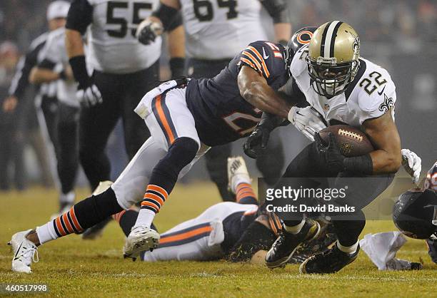 Mark Ingram of the New Orleans Saints is tackled by Ryan Mundy of the Chicago Bears during the first quarter at Soldier Field on December 15, 2014 in...