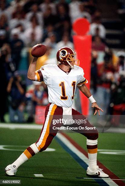 Mark Rypien of the Washington Redskins looks to pass against the Buffalo Bills during Super Bowl XXVI at the Metrodome in Minneapolis, Minnesota...