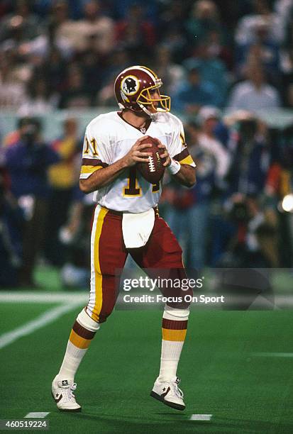 Mark Rypien of the Washington Redskins drops back to pass against the Buffalo Bills during Super Bowl XXVI at the Metrodome in Minneapolis, Minnesota...