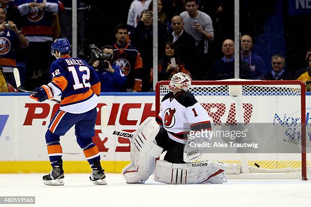 Josh Bailey of the New York Islanders scores on Keith Kinkaid of the New Jersey Devils in the shootout during a game at the Nassau Veterans Memorial...