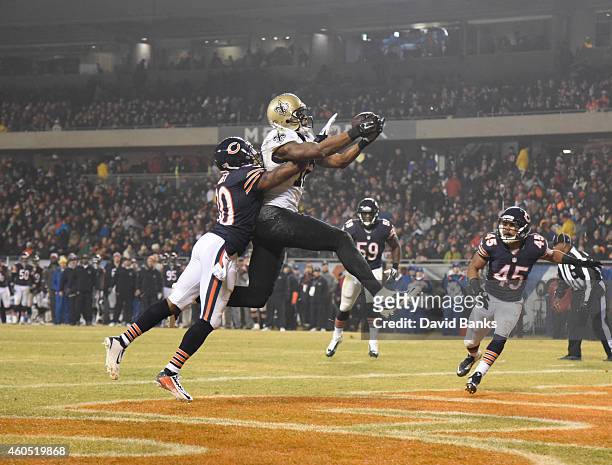 Marques Colston of the New Orleans Saints catches a touchdown in front of Demontre Hurst of the Chicago Bears during the second quarter on December...
