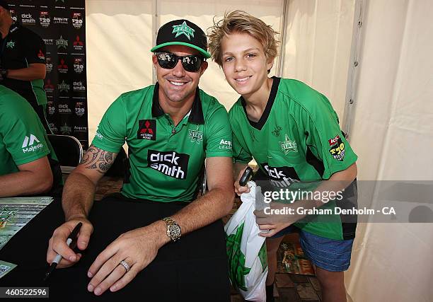 Kevin Pietersen of the Melbourne Stars poses with a young fan during the Melbourne Stars derby launch at Federation Square on December 16, 2014 in...