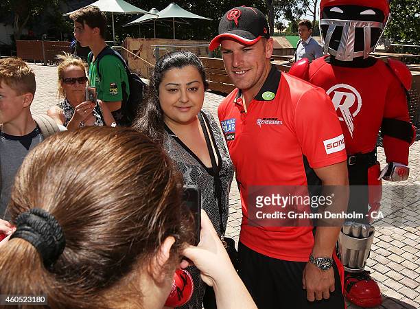 Aaron Finch of the Melbourne Renegades poses with fans during the Melbourne Stars derby launch at Federation Square on December 16, 2014 in...