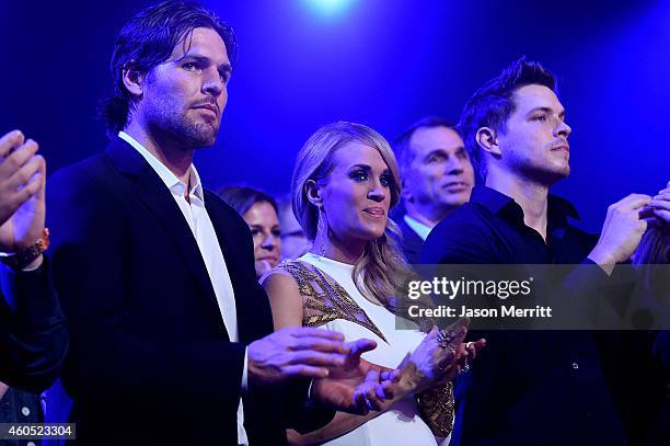 The Nashville Predators' Mike Fisher and recording artist Carrie Underwood attend the 2014 American Country Countdown Awards at Music City Center on...