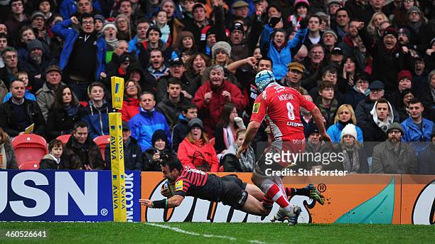 Saracens player Neil de Kock dives over for the first try during the Aviva Premiership match between Gloucester and Saracens at Kingsholm Stadium on...