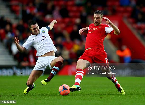 Jason Shackell of Burnley tackles Rickie Lambert of Southampton during the FA Cup with Budweiser Third round match between Southampton and Burnley at...