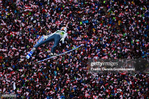 Thomas Diethart of Austria soars through the air during his first round jump on day 2 of the Four Hills Tournament event at Bergisel on January 4,...