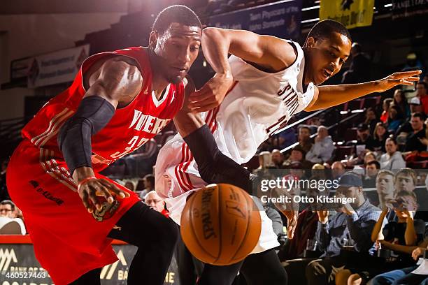 McCollum of the Idaho Stampede passes against Robert Covington of the Rio Grande Valley Vipers during an NBA D-League game on January 3, 2014 at...