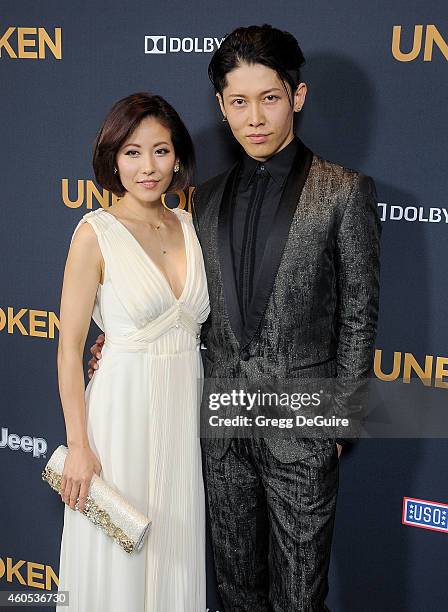 Actor Miyavi and Melody Ishihara arrive at the Los Angeles premiere of "Unbroken" at The Dolby Theatre on December 15, 2014 in Hollywood, California.